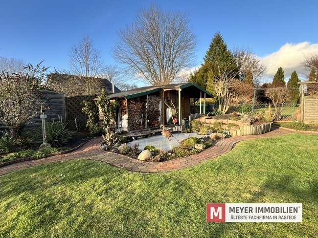 Gepflegtes Einfamilienhaus mit Wintergarten und Teichanlage! (Obj.-Nr. 6584)